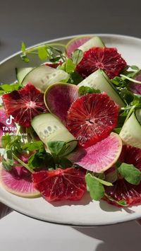 A delicious winter salad made with pea shoots, watermelon radishes, blood oranges and cucumbers.