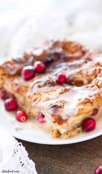 This easy homemade Cranberry Orange Bread Pudding is topped with an orange glaze, and is the perfect holiday dessert! This bread pudding recipe comes together quickly and is a total crowd pleaser!