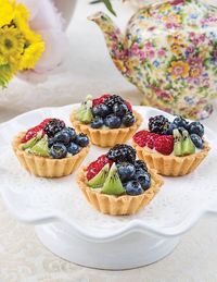 Fresh berries, sliced kiwi, and Elderflower Pastry Cream create a colorful and scrumptious dessert in Elderflower Fruit Tartlets.