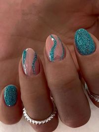 glittery teal nails with swirls