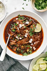 This Mexican birria de res crockpot recipe is a hearty slow-cooked stew with the utmost flavor and juicy, tender beef. Serve it as is or make birria tacos!