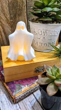 "Boo!... This cute Mini Ghost is perfect for your special BOO! It can sit on your mantle, or any space in your home or office! He stands 3 inches tall and almost 4 inches wide. This friendly ghost is 3D Printed and place a FLAME LESS tea candle underneath it and he will glow in the dark! The light peeks through the eyes and openings in the ghost! When you receive your little ghost you will also receive (1) flame-less tea candle, so he will be ready to glow for you! Measurements: Height: 3\"( PLE