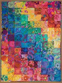 Julia Hill Enzenberger‎ from Kaffe Fassett Collective.  This is a quilt I finished recently. I've named it Floral Rainbow. It has 108 different Philip and Kaffe prints in it. The blocks are 6.5" cut. The finished size is 54" by 72".