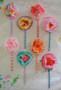 A bouquet of flowers made with cupcake liners and paper straws. A wonderful open-ended art activity for all ages.