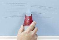 Touch-up tool covering up scratches on a wall