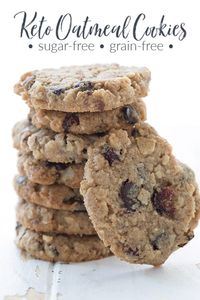 Keto oatmeal cookies in a stack on a white table.