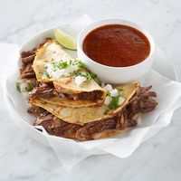 When making birria tacos, the cooking broth is just as important as the meat. The tortillas are dipped in the broth before making the tacos, and a cup of broth is served on the side for extra dipping.