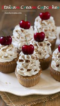 Italian Cream Cupcakes - Light, airy and rich vanilla buttermilk and almond cupcakes blended with sweetened coconut and pecans. Topped with the ultimate cream cheese and buttercream frosting with cherries and pecans. These cupcakes will quickly become a family favorite. Serve for the holidays or during summer months when fresh cherries are readily available.