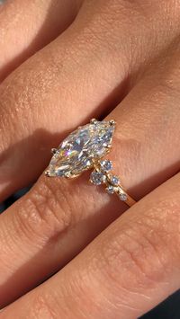 This whimsical design features an 18k yellow gold vintage inspired setting holding a gorgeous 2.7 ct marquise center stone with a cascade of diamonds down the band  From the Modena Collection by @ascotdiamonds   #marquise #whimsical #custom #handmade #engagementinspiration #ascot #ascotdiamonds #ascotdiamondsatlanta