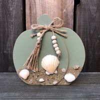 "Add some coastal fall decor to your home with this rustic wood pumpkin with sand and seashell accents!  Set it on your mantel, living room, office, kitchen & more! Makes a great Thanksgiving hostess gift Each piece is hand crafted and one of a kind. Measures approximately 5.5\" wide x  5.25\" tall.  Browse more beach decor: https://www.etsy.com/shop/socialbutterflies?show_panel=true&section_id=33536454 Thanks for visiting Social Butterflies!"