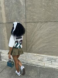 shirt: SHEIN Camouflage Printed Baseball Jersey T-Shirt  skirt: SHEIN ICON Women's Fashion Solid Color Latin Style Crop Pleated Y2K Green Pleated Skirt  shoes: Samba OG Shoes   #backtoschooloutfits #pinterest #explore #ideas #camo #cute #core