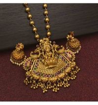 Classic Antique Gold Plated MC Ball Lakshmi Pendant Set in a matte finish. Team this necklace set with any r outfits for parties, Weddings or Engagements.