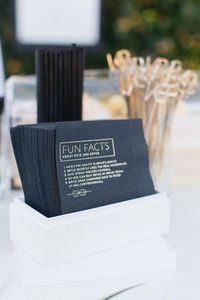 Love these custom printed cocktail napkins for a wedding bar featuring fun facts about the bride and groom