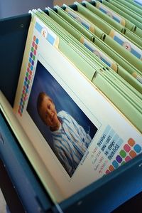 File folders for K-12 to hold memorable school items and showcase that years school photo.