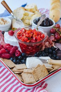 The perfect 4th of July Appetizer is a patriotic charcuterie board.  Gather together  your favorite red and blue fruits and add meat and cheese. #patriotic #patrioticappetizer #4thofjulyideas #4thofjuly #4thofjulyparty #4thofjulyfood #cheeseboard #charcuterie #charcuterieboard