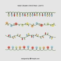 Hand-drawn christmas lights collection Free Vector