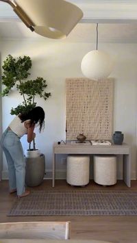 Looking for new decor ideas for your entryway? Style your home with these neutral home finds to create a modern entryway. Check out these styling tips and adding decor elements to your organic consoles, neutral ottomans and Japandi style table decor. Add a pendant light to create a warm and cozy atmosphere.