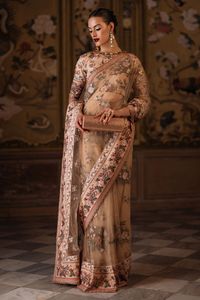 Nuha is the epitome of grace with a sequined, embroidered floral net saree paired with a sleek silk blouse. A perfect harmony of elegance and modern allure.