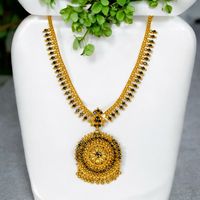 Stylish Gold Plated Black Cz's  Floral Pendant Necklace, perfect for weddings and parties. This delicate necklace, designed creatively and intricately, is adorned with premium black American diamonds. Its trendy and sophisticated design will attract attention and enhance your beauty, giving you an elegant and fashionable look. It also makes an excellent gift for loved ones on special occasions.