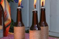 Instead of throwing away empty wine and beer bottles, make kick-ass tiki torches that will wow everyone. | Reuse Old Wine Bottles As Incredibly Cute Tiki Torches