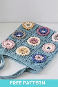 This Granny Square Tote Bag made with soft, pastel colors of Hobbii Acacia yarn creates an eye-catching accessory that complements any spring outfit and brings a dash of joy and color to your daily life. The bag is made of 18 flower granny squares. Each flower is made with popcorn stitch, which gives them puffiness and 3D effect. Colors of the flowers are chosen randomly and each flower has a different color combination. You can mix and match any color you want to make your own combination.