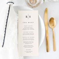 Share your wedding reception menu details in elegant style with these monogram wedding menu cards in warm ivory ecru with your initials in traditional serif black lettering, bisected by a thin vertical line. Customize the header and menu items arranged by course.