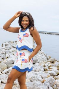 Get ready to celebrate Independence Day in style with our White & Navy American Flag Skirt! This fun and patriotic skirt features sparkling sequin flags and a unique wavy base. Complete your look by pairing it with our matching tank top. 🇺🇸🎆 Model is wearing a small. Care Instructions: hand wash only, inside out