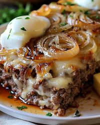 French Onion Meatloaf 🧅🍖  Ingredients  1 1/2 pounds ground beef 1 cup breadcrumbs 1/2 cup milk 2 large onions, thinly sliced 2 cloves garlic, minced 1 egg, beaten 2 tablespoons Worcestershire sauce 1 tablespoon Dijon mustard 1 teaspoon dried thyme 1/2 teaspoon salt 1/2 teaspoon black pepper 2 tablespoons butter 1/4 cup beef broth 1 cup shredded Gruyère or Swiss cheese Instructions Preheat the Oven:  Preheat your oven to 350°F (175°C). Caramelize the Onions:  In a skillet over medium heat, melt the butter. Sauté the thinly sliced onions until they are caramelized and golden brown, about 20-25 minutes. Add a splash of beef broth to deglaze the pan and stir until the liquid is absorbed. Set aside to cool. Prepare the Meatloaf Mixture:  In a large bowl, combine the ground beef, breadcrumbs,