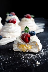 Pavlova is one of the most delicate desserts ever. I love making this berry almond pavlova with lemon curd and I love eating it! Learning an easy pavlova recipe means you can make this impressive dessert whenever the mood hits. Plus it is a bonus that it is a gluten free dessert. If you are looking for a recipe for a dessert with fresh berries or an easy pavlova recipe, this is one to try! Have you ever had pavlova with lemon curd? #pavlova #glutenfree #dessert #eggwhite #berries #lemoncurd