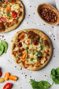 A simple four-ingredient pizza dough recipe for making delicious homemade pizza.  Top with fresh, seasonal ingredients for a delicious weeknight dinner. #homemadepizzadough #homemadepizza #thesweetoccasion