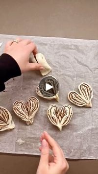 1.6K views · 18K reactions | It seems like Valentine’s Day is already in the air❤️, so why not make these super easy and delicious puff pastry hearts?
Let’s prepare them together…

🥣 Ingredients:
1 rectangular puff pastry sheet
Hazelnut spread
Chopped hazelnuts
Powdered sugar
🥣 Roll out the puff pastry and divide it into 8 rectangles.
🥣 Spread the hazelnut cream and sprinkle with chopped hazelnuts.
🥣 Roll each piece from the longer side to create 8 cylinders.
🥣 Join the ends together and freeze for 5 minutes.
🥣 Then, cut each piece while keeping the tips connected, and open them to form heart shapes.
🥣 Place them on parchment paper on a baking tray and bake in a preheated static oven at 170°C for 25 minutes. Let cool, then dust with powdered sugar.
Credit: @impastandoaquattromani 

