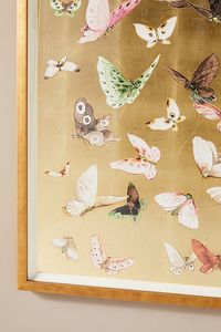 This visually captivating piece features elegant butterflies fluttering across an opulent background of hand-applied gold leaf. | Golden Flight Wall Art by Anthropologie, Size: Large