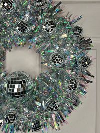 Handcrafted Decorative Show Stopping Disco Ball Wreath Perfect for Wedding / Festival / Disco Decor / Christmas Decor Diameter approximately 38cms  This version has a larger disco ball in the centre For Indoor or covered Use Only - due to the fragile materials - On a Foam Base Wall Art / Disco Art/  wedding wreath / christmas wreath / Kitsch Wreath / disco ball Wreath / party Wreath / Christmas Decoration / silver wreath / disco wreath / silver christmas