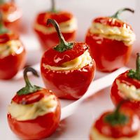 Stuffed peppers make a colorful appetizer for your next dinner party. The cool cream cheese mellows the heat of the pepper, offering your guests a true explosion of flavor.