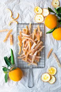 An easy recipe for candying orange peel, with step-by-step photos. Use them in your favorite recipe, dip them in chocolate for a sweet treat, or give them as homemade gifts! #candiedorangepeel #homemadegifts #foodgifts #candiedpeel