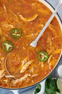 Mexican Chicken Rice Soup is made with chicken, brown rice, tomatoes, onion and lots of garlic. This nourishing chicken and rice soup is one of my favorite Mexican soup recipes to make and it rivals any restaurant Mexican chicken rice soup there is! #chickensoup #mexicansoup #mexicanfood #healthysouprecipe