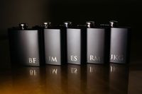 You can never go wrong with giving your groomsmen engraved flasks.