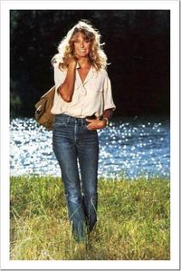 Get yourself this chic and cheerful 70's look! Style some boot cut vintage jeans with an open blouse and leather satchel. Picturesque scenery not included.