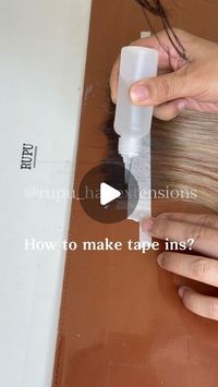 Hair Factory | Vlight | Genius Weft | Invisible Tapes on Instagram: "How to make tape ins? . . . #tapeinextensions #tapehairextensions #tapeextensions #hairtutorials #hairtutorialvideo #lasvegashairstylist #maneaddicts #redkinshadeseq #thebtcteam #saloncentric #salonbusiness #foilyage #brunettebalayage #brunettehair #showmethebalayage #hairreels #haireducation"