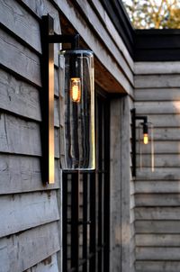 Dome Outdoor Wall Light features Clear, Amber, or Smoke glass with a Black or White finish. IP43 rated. Made in Belgium.