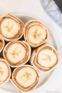 You have to try this easy Banana Peanut Butter Roll ups for an easy after school snack. These 3 ingredient banana peanut butter rolls are always a favorite!