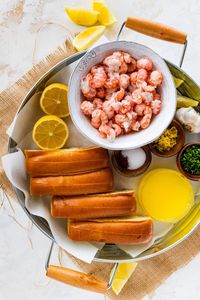 Amazing Langostino Lobster Rolls Recipe (Easy!): The langostino tales are basted in a rich garlic-lemon butter sauce and served in butter-toasted brioche