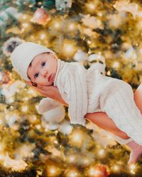 Baby dressed in an all-white outfit