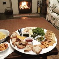 Lounge area of Rush Cottage with open fire and a glass of red wine! Bliss!