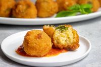 If you're looking for an Italian side dish or appetizer, this vegan artichoke arancini is perfect! Since this version of the bite-sized Italian favorite is completely dairy-free and vegan, it's a great option for when you're serving up food to people with a variety of diets.Arancini might be one of my favorite street f