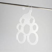 Acrylic hanger for holding multiple scarves, integrated hook for use in wardrobes.