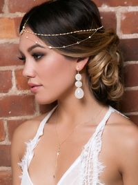 This one of a kind handmade bridal headpiece is a unique and luxurious item. The cubic zirconia stones and glass pearls create a gorgeous bohemian look while the contrasting 14K gold delicate chain ad