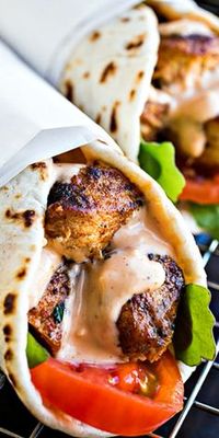 Grilled Lemon Chicken Flatbread wraps with spicy garlic sauce. This is loaded with different flavors and a great dish to try with you and the family.