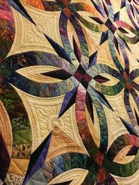 I cannot believe I didn’t blog about this quilt!  This quilt has such a story to tell. The piecer of this quilt – Lorna – had been bringing me quilts for a while. Lots of fabulous…