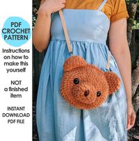 This is a crochet pattern PDF, not a finished item. Make an adorable plushie bear bag with this crochet pattern! This bag has a zipper closure, and is fully lined. It can hold a small phone (5.6 inches tall max) and a small wallet, plus some small essentials like keys and lip balm. The bear bag measures about 7.5 inches wide by 6.5 inches tall (not including ears), and uses a combination of fabric glue (optional) and hand stitching to construct the bag. You can make it without the lining, it's very sturdy even without it. >> Pattern level: Experienced. The crochet itself is simple, but the texture of the yarn makes it difficult to put together. The lining and zipper also increase the difficulty. This definitely isn't for beginners. >> Sizes included: one size, about 7.5 inches wide by 6.5